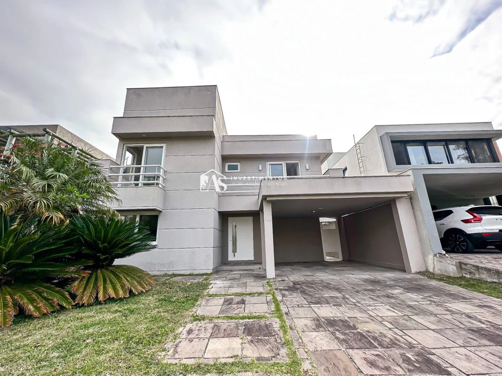 Casa de Luxo com 4 Suítes, Piscina Aquecida e Vista Espetacular para o Lago Navegável do Condomínio mais Luxuoso de Porto Alegre